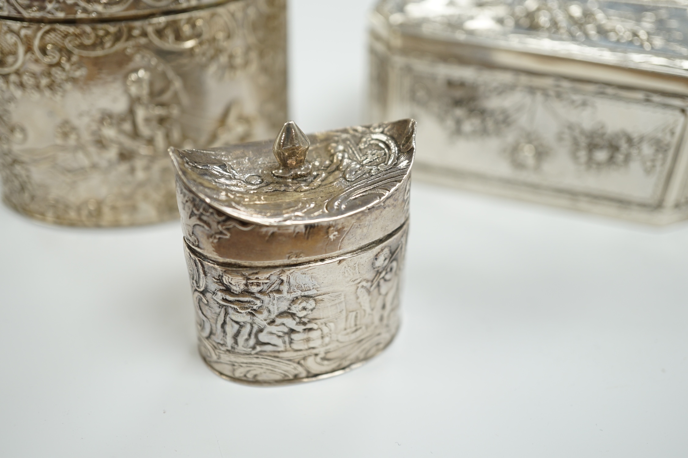 Three assorted late 19th century Dutch white metal boxes, largest 80mm.